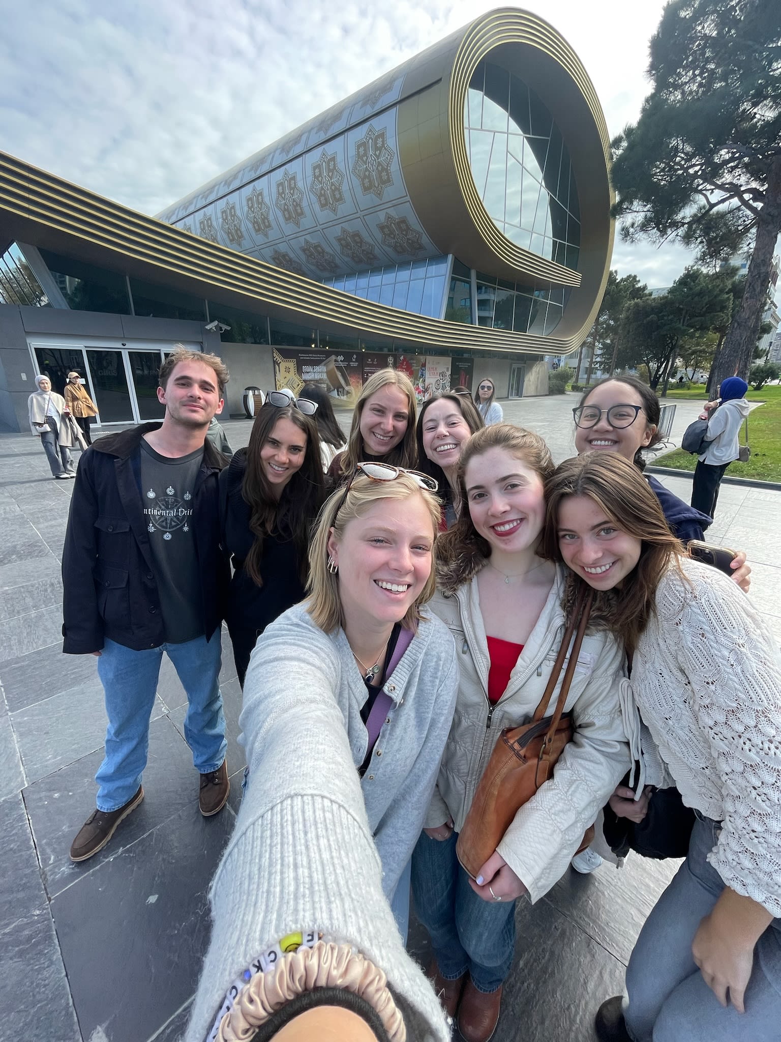 Megan O'Brien '25, Ashley Entwistle '26, Ella Reese-Clauson '26, Isabella Childs Michael '25, Jessica Legaard '25, Havalin Haskell ’26, and Jamie Harvie ’25 took a picture outside of the Azerbaijan National Carpet Museum while in Baku for COP29.