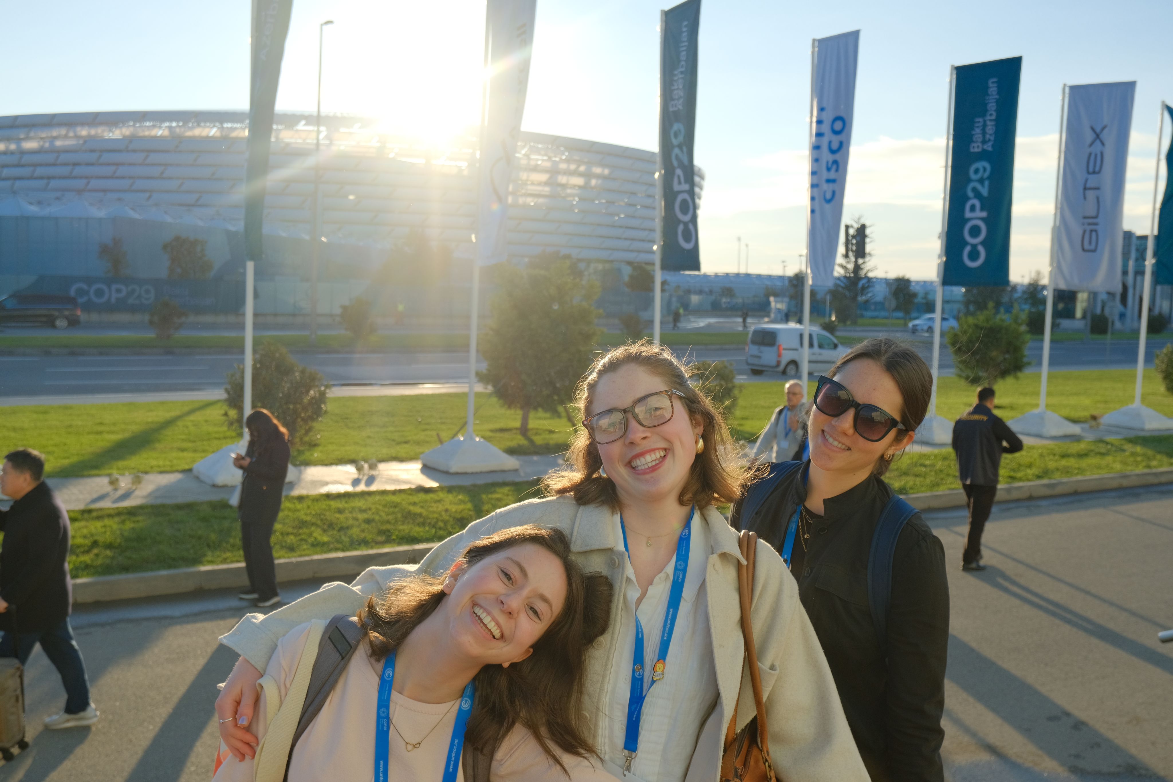 Jessica Legaard '25, Isabella Childs Michael '25, and Havalin Haskell ’26 outside the green zone at COP29 in November 2024.