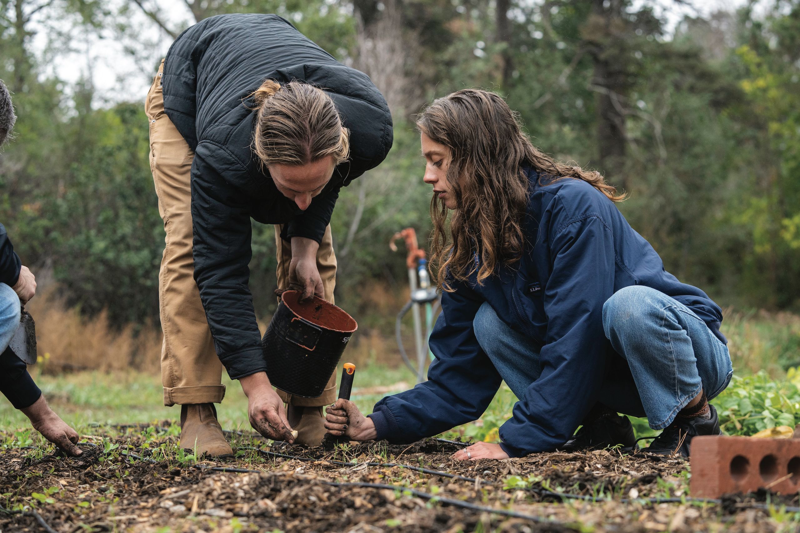 Kai Matthiasson ’23 and Emily Newhall ’26 worked hard to plant the garlic for the season at the Colorado College Farm.