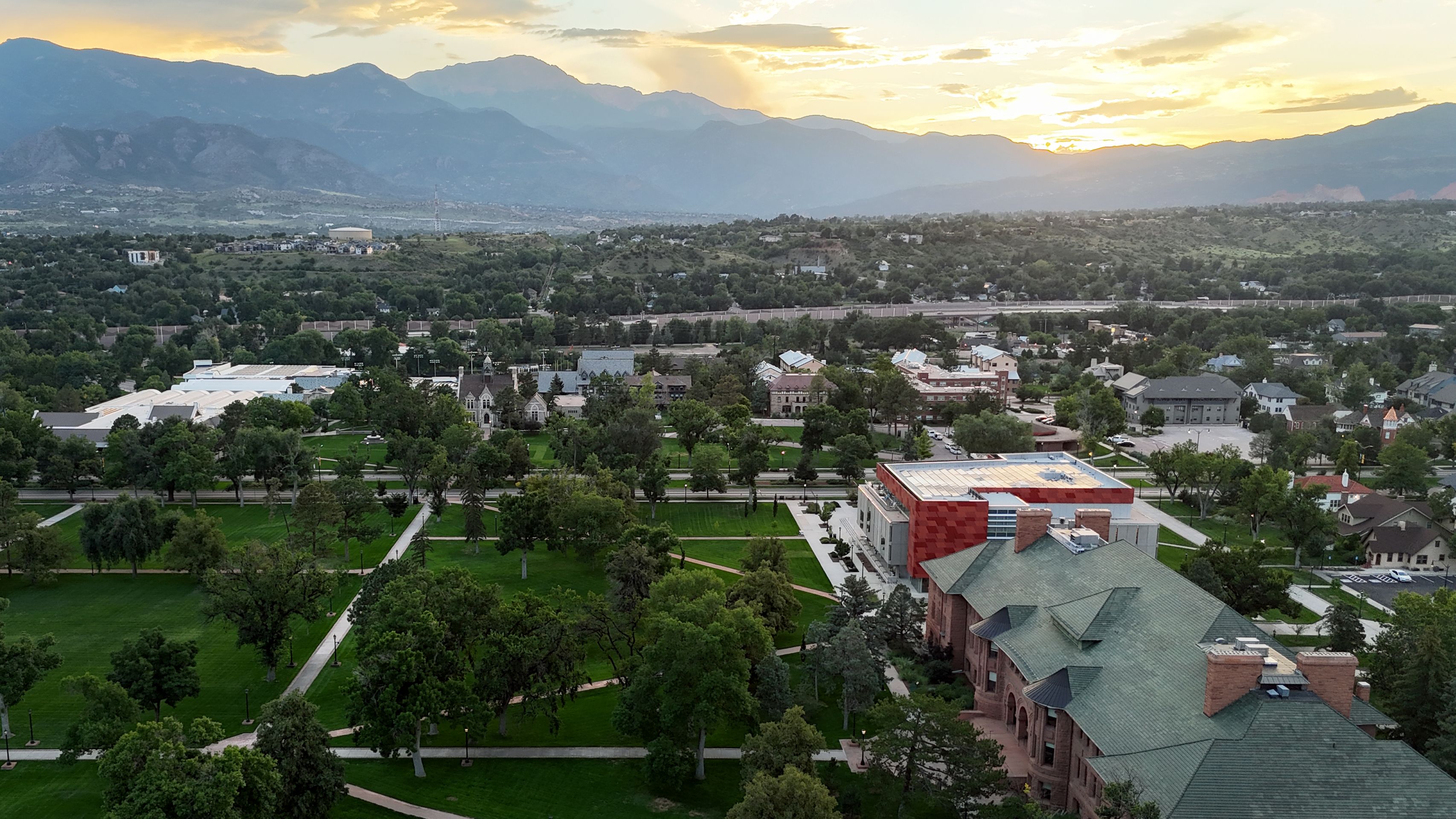 Drone aerial photo of Colorado College's quads in front of Tutt Library and Palmer Hall facing west.