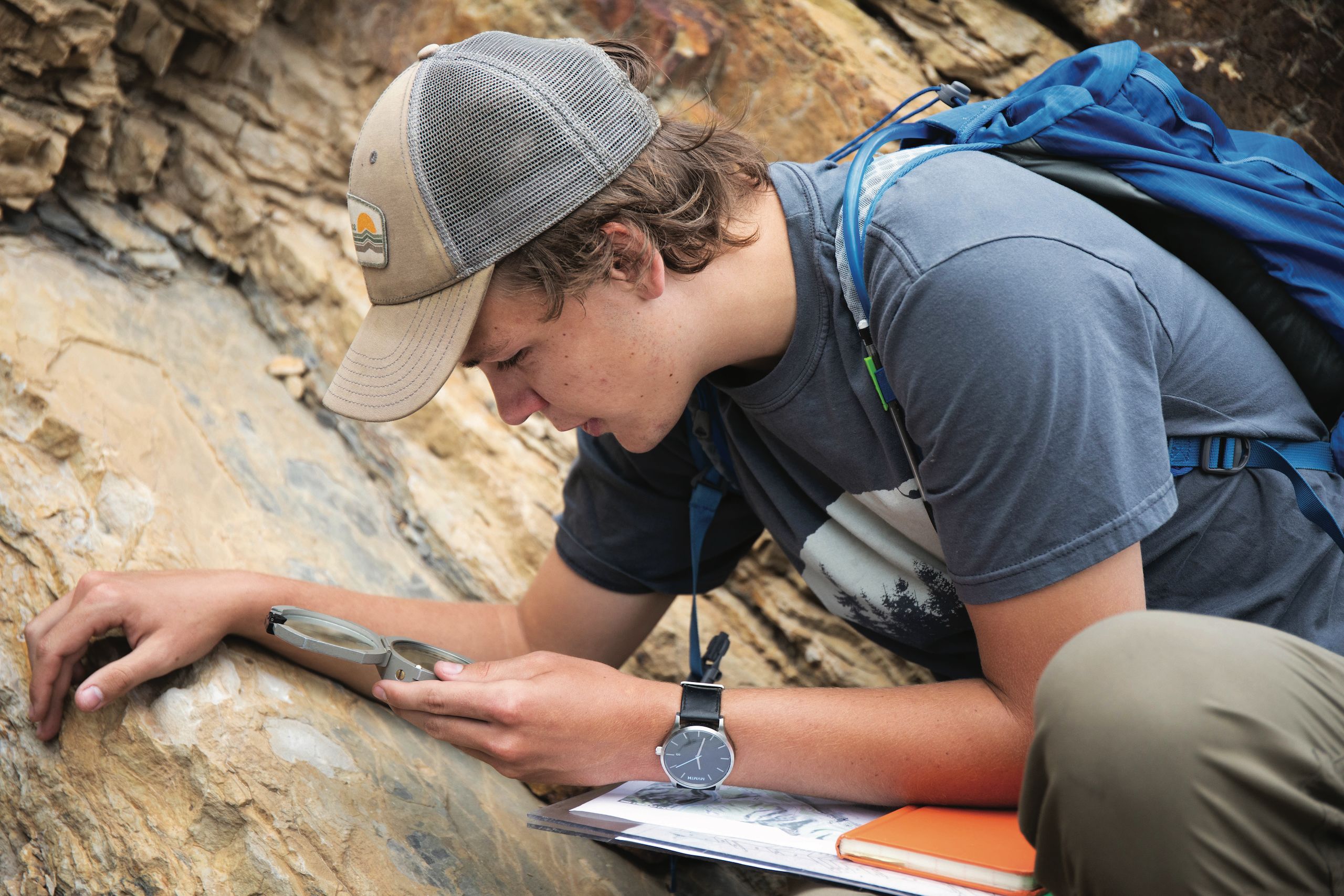Drew Shippey ’21 calculates the direction of a rock formation. Visiting professor Dr. Tim Gibson led his Geology of the Pikes Peak Region class on a hike through Wide Eagle Trail in Cañon City to investigate rock types and learn the skill of measuring hits and strikes for rock formation.