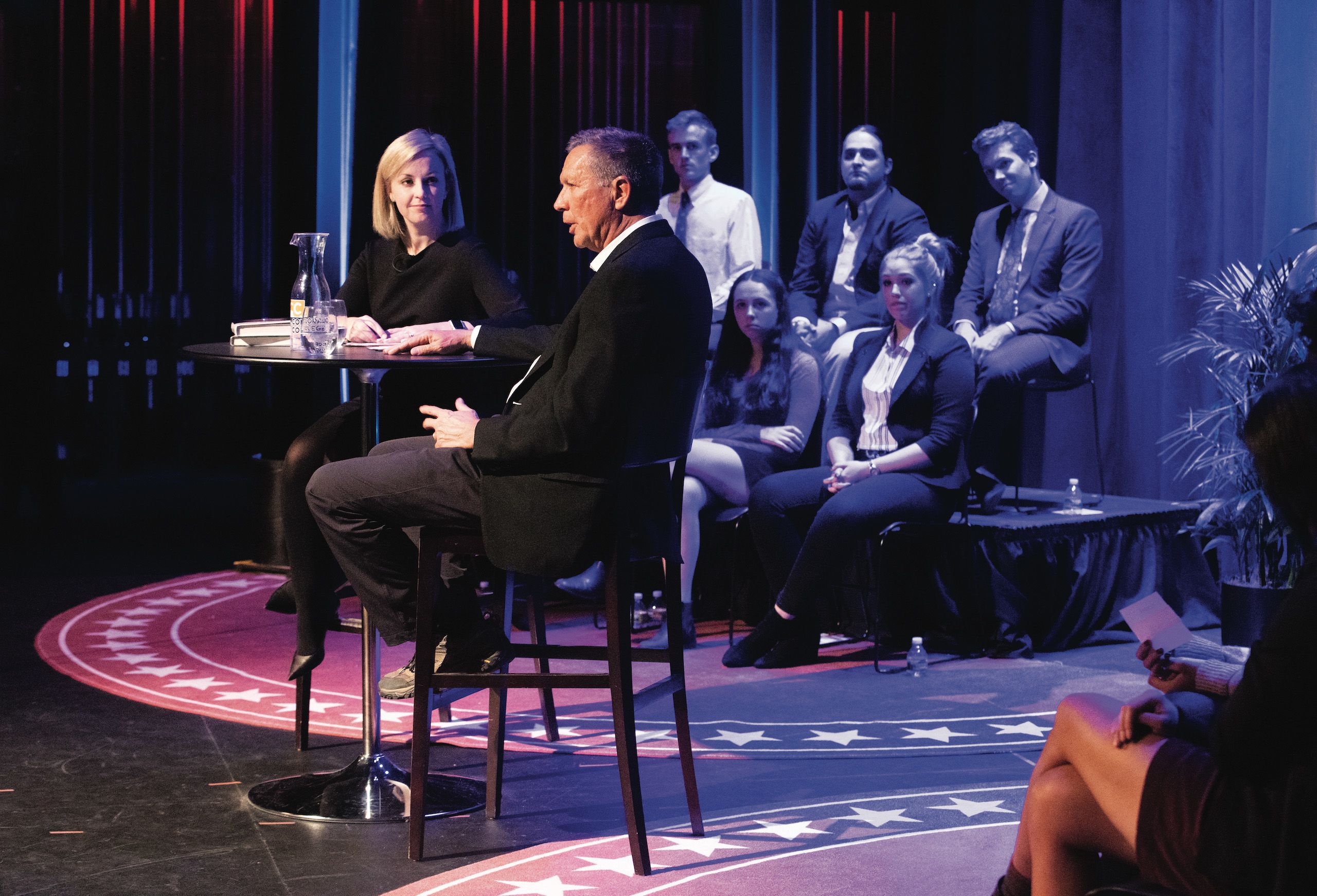 Dr. Elizabeth Coggins hosted a town hall-style meeting with Ohio Governer, former senator, and past presidential candidate John Kasich as a part of the Midterm Symposium. Coggins' students prepared questions that they were given the opportunity to ask Kasich.
