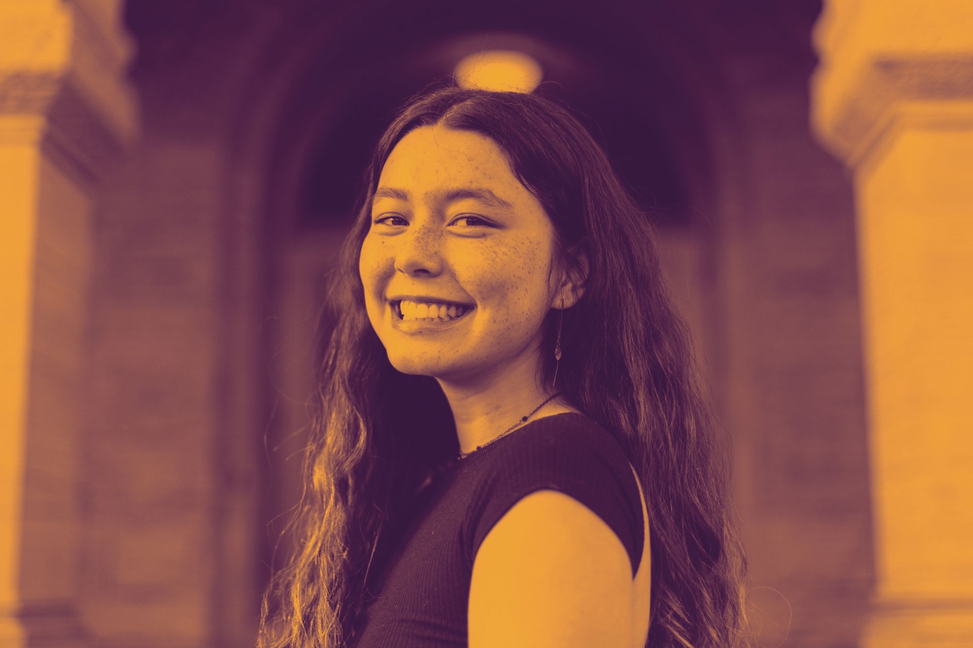 Sophia Murphy '27 smiling in front of Palmer Hall