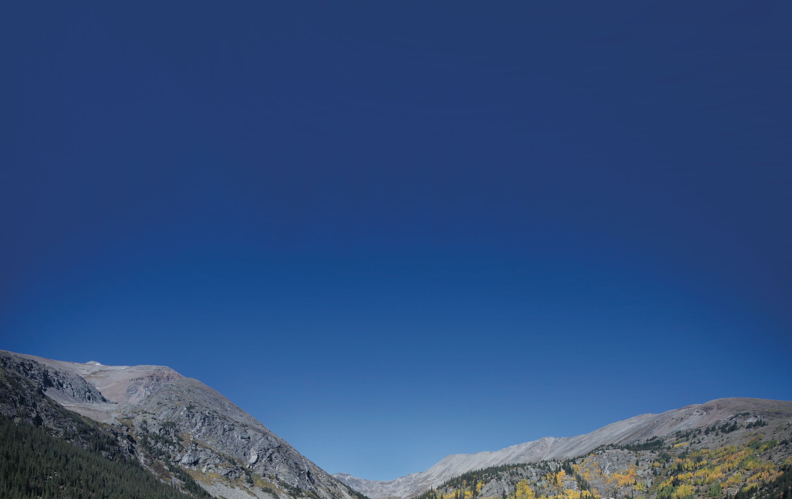Colorado mountains against a cloudless blue sky