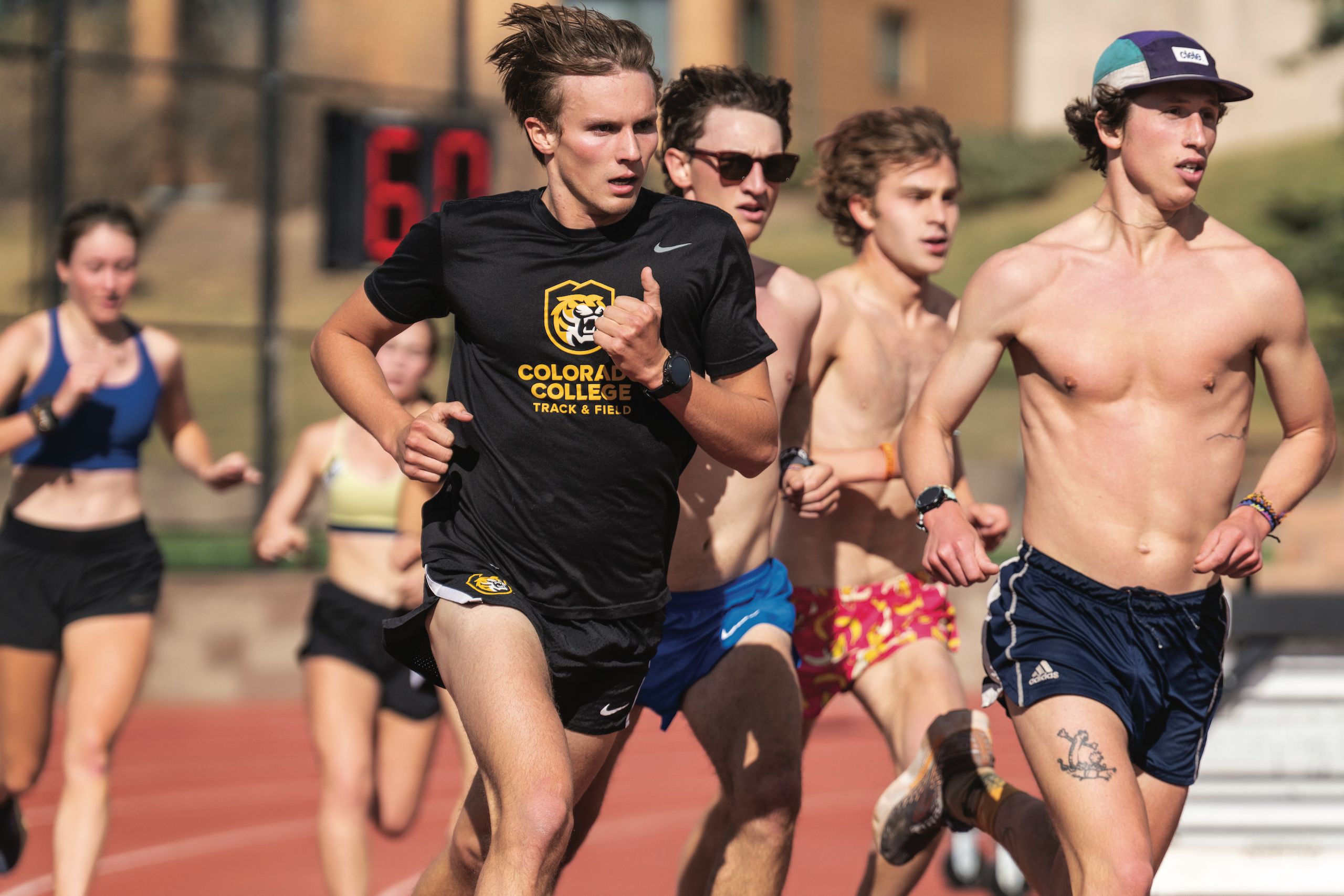 Members of the CC track & field running during practice