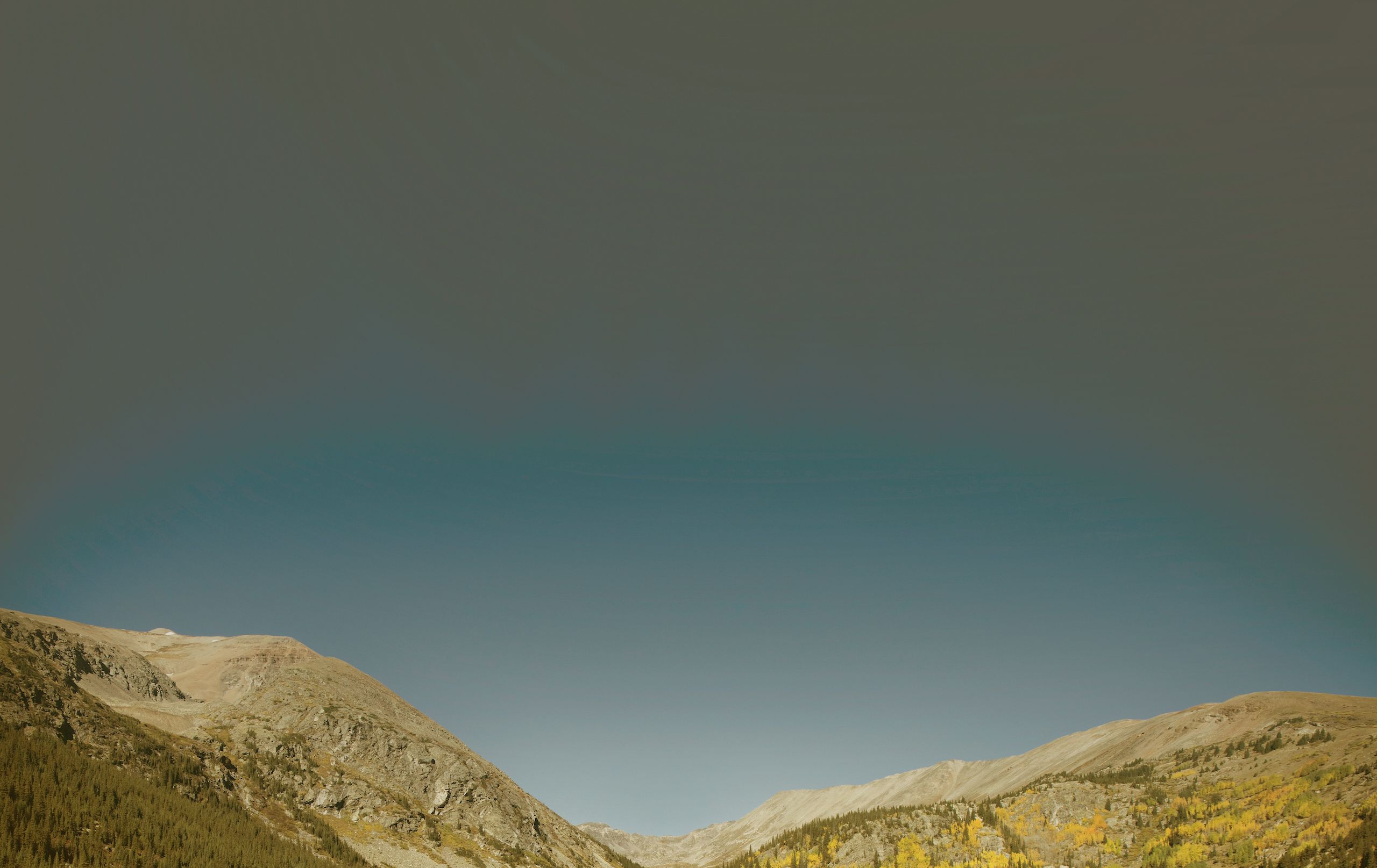 Colorado mountains against a cloudless blue sky